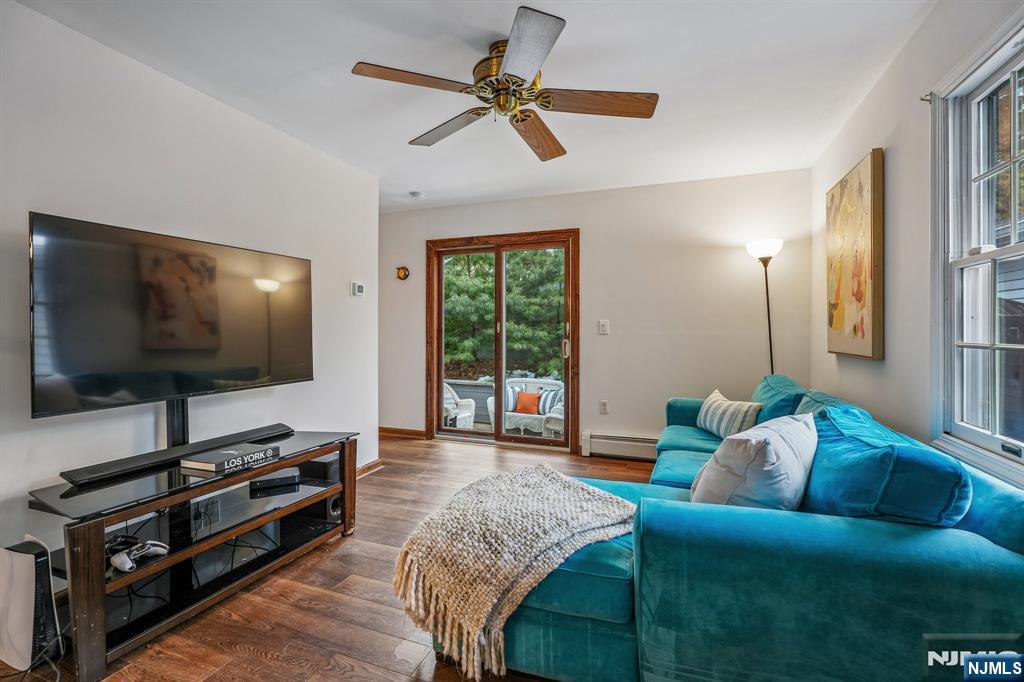 40 Golf Road Bloomfield, NJ 07003 - Photo 22 of 50 a living room with furniture and a flat screen tv