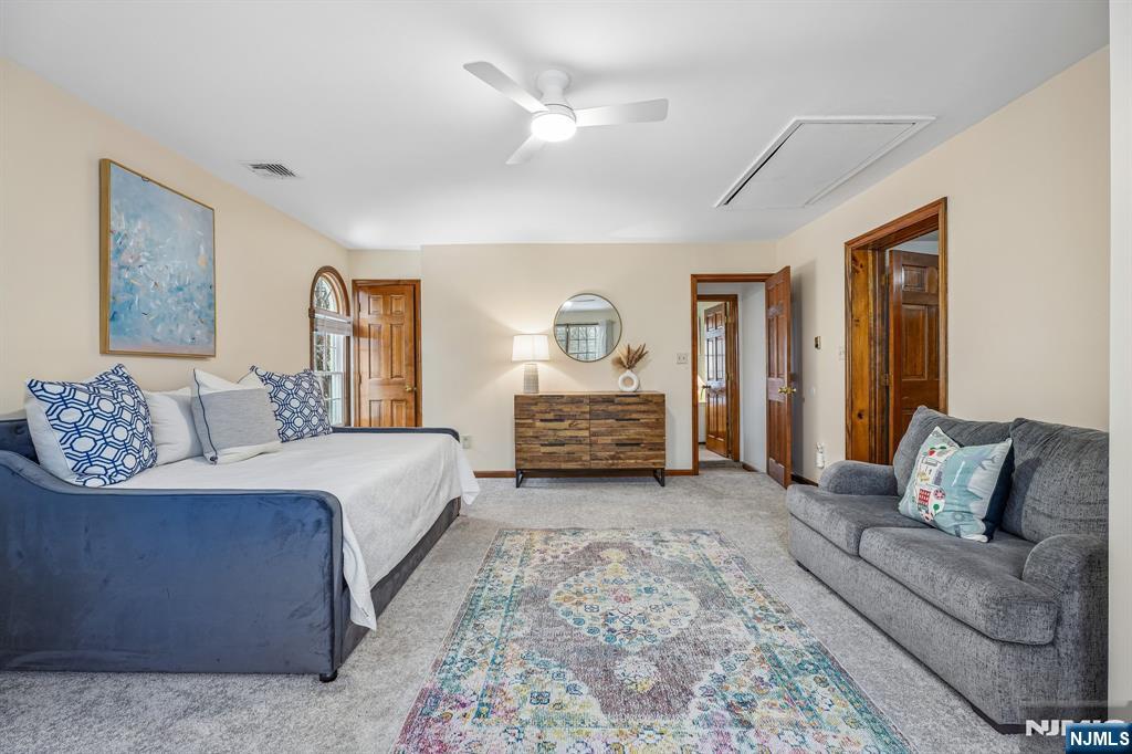 40 Golf Road Bloomfield, NJ 07003 - Photo 34 of 50 a spacious bedroom with a bed and a couch