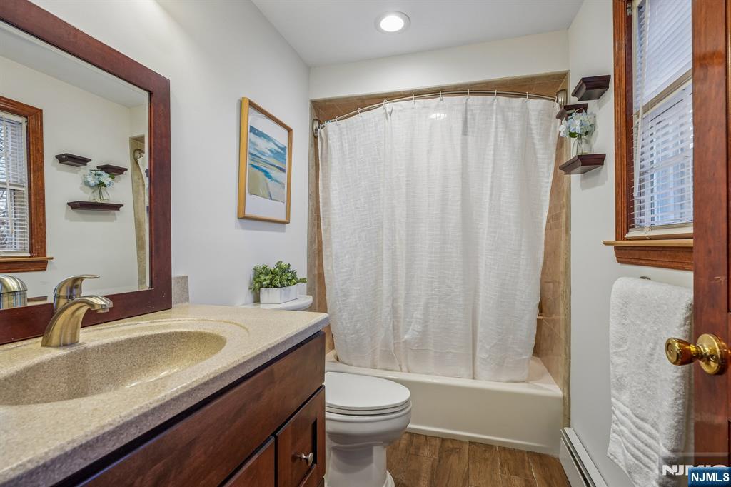 40 Golf Road Bloomfield, NJ 07003 - Photo 39 of 50 a bathroom with a granite countertop sink toilet and shower