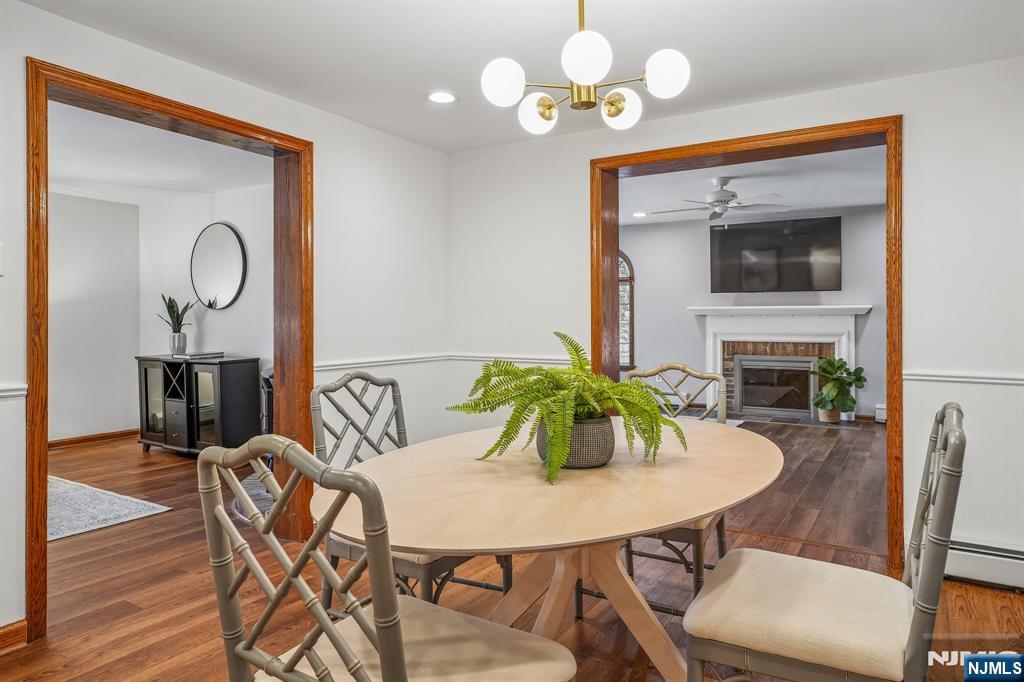 40 Golf Road Bloomfield, NJ 07003 - Photo 10 of 50 a view of a dining room with furniture and wooden floor