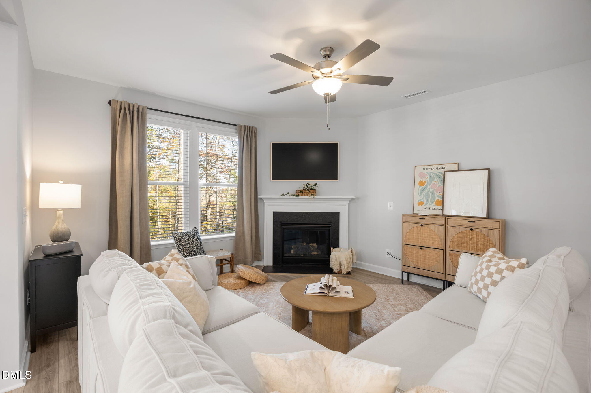 321 Pond Overlook Court Knightdale, NC 27545 - Photo 15 of 41 a living room with furniture a fireplace and a flat screen tv
