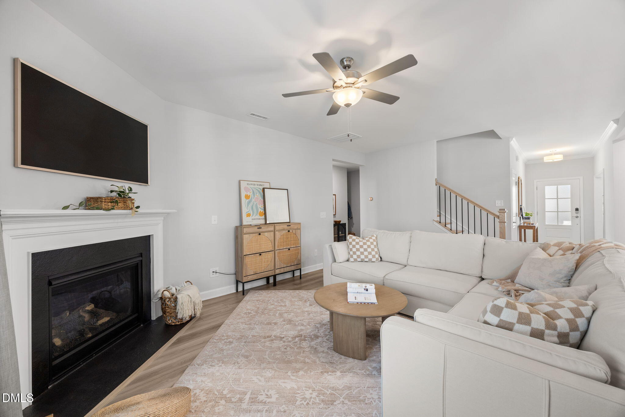 321 Pond Overlook Court Knightdale, NC 27545 - Photo 17 of 41 a living room with furniture a flat screen tv and a fireplace