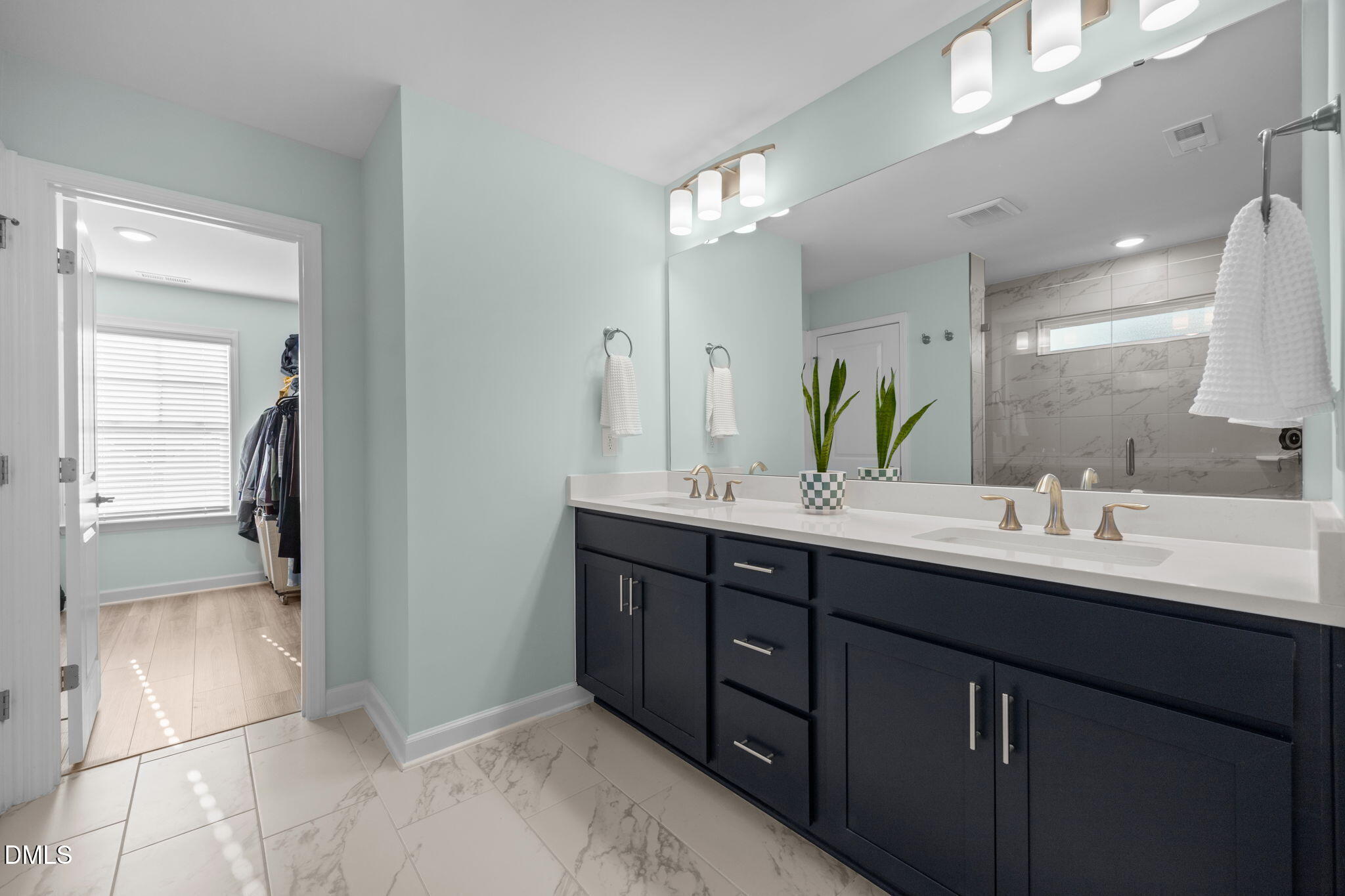 321 Pond Overlook Court Knightdale, NC 27545 - Photo 23 of 41 a bathroom with a double vanity sink and a mirror