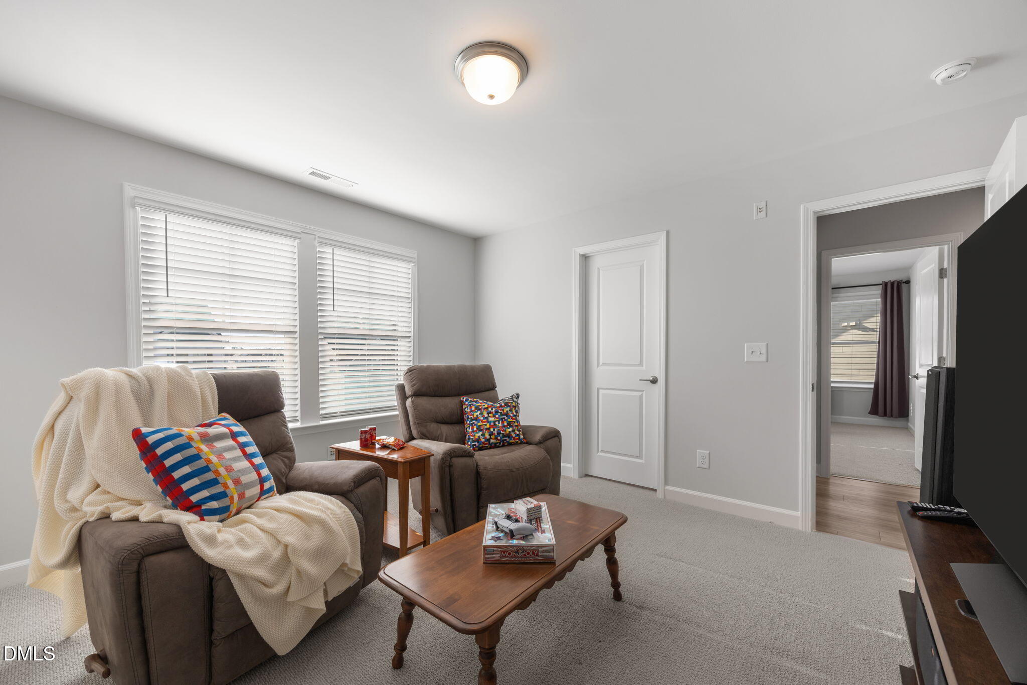 321 Pond Overlook Court Knightdale, NC 27545 - Photo 27 of 41 a living room with furniture and a flat screen tv