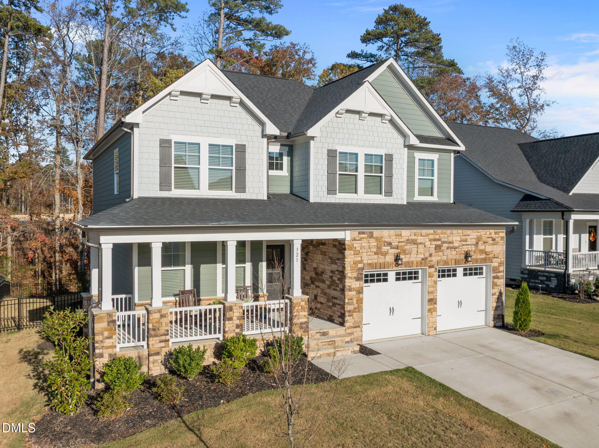 321 Pond Overlook Court Knightdale, NC 27545 - Photo 3 of 41 a view of a white house with large windows and potted plants