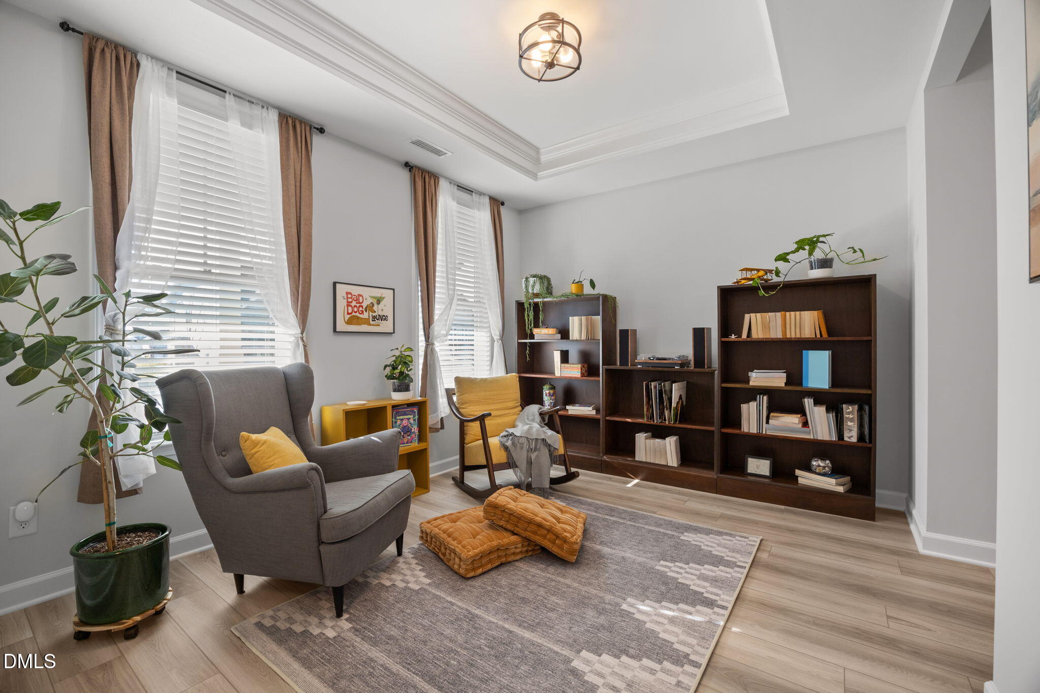 321 Pond Overlook Court Knightdale, NC 27545 - Photo 6 of 41 a living room with furniture and a book shelf