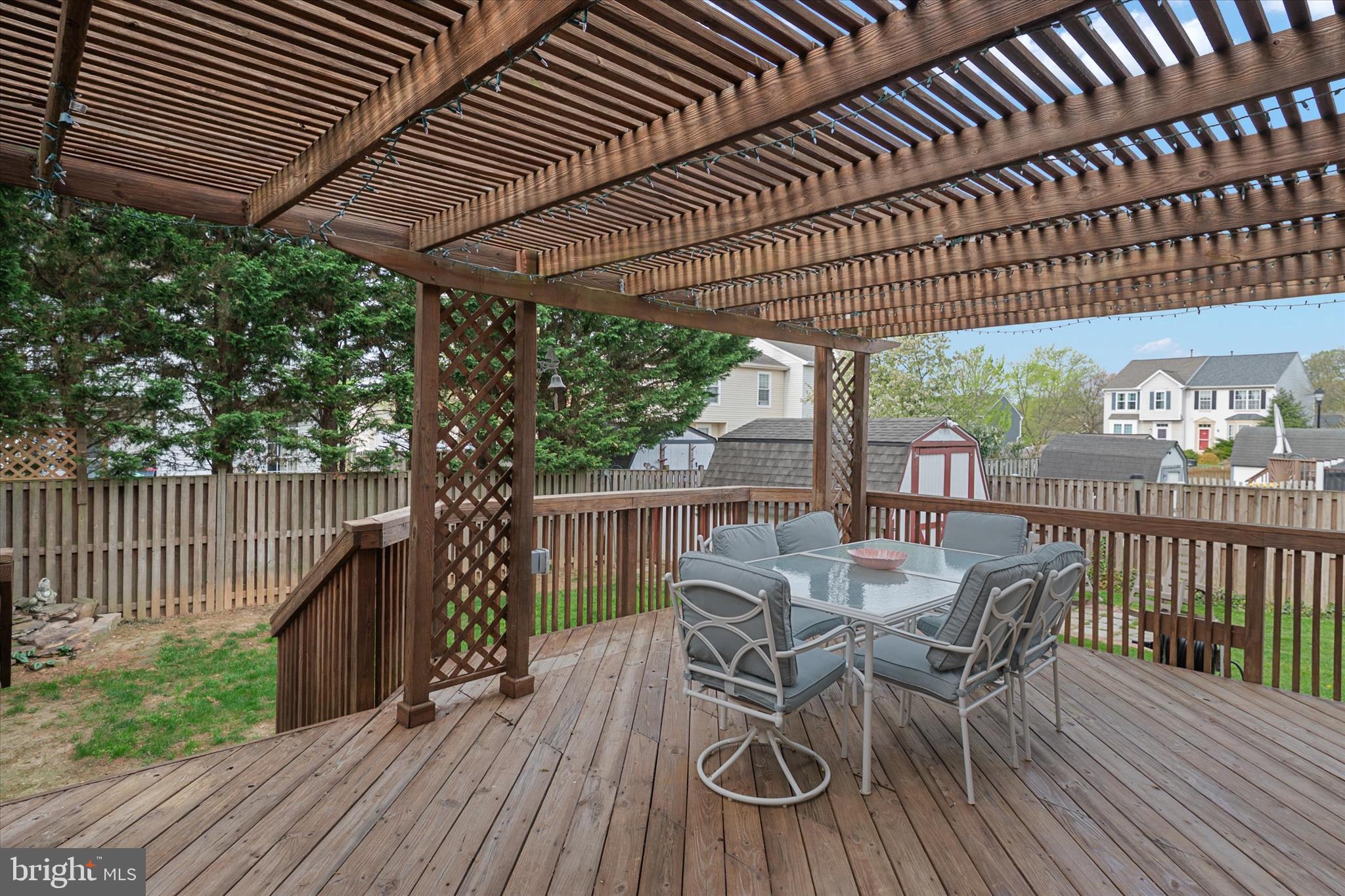 2275 Lea Court Odenton, MD 21113 - Photo 16 of 55 a view of a roof deck with table and chairs and wooden floor