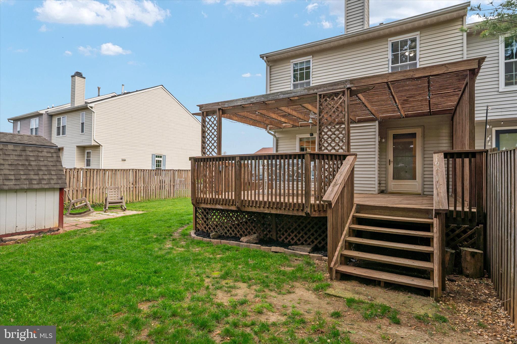 2275 Lea Court Odenton, MD 21113 - Photo 18 of 55 a view of a house with backyard and deck