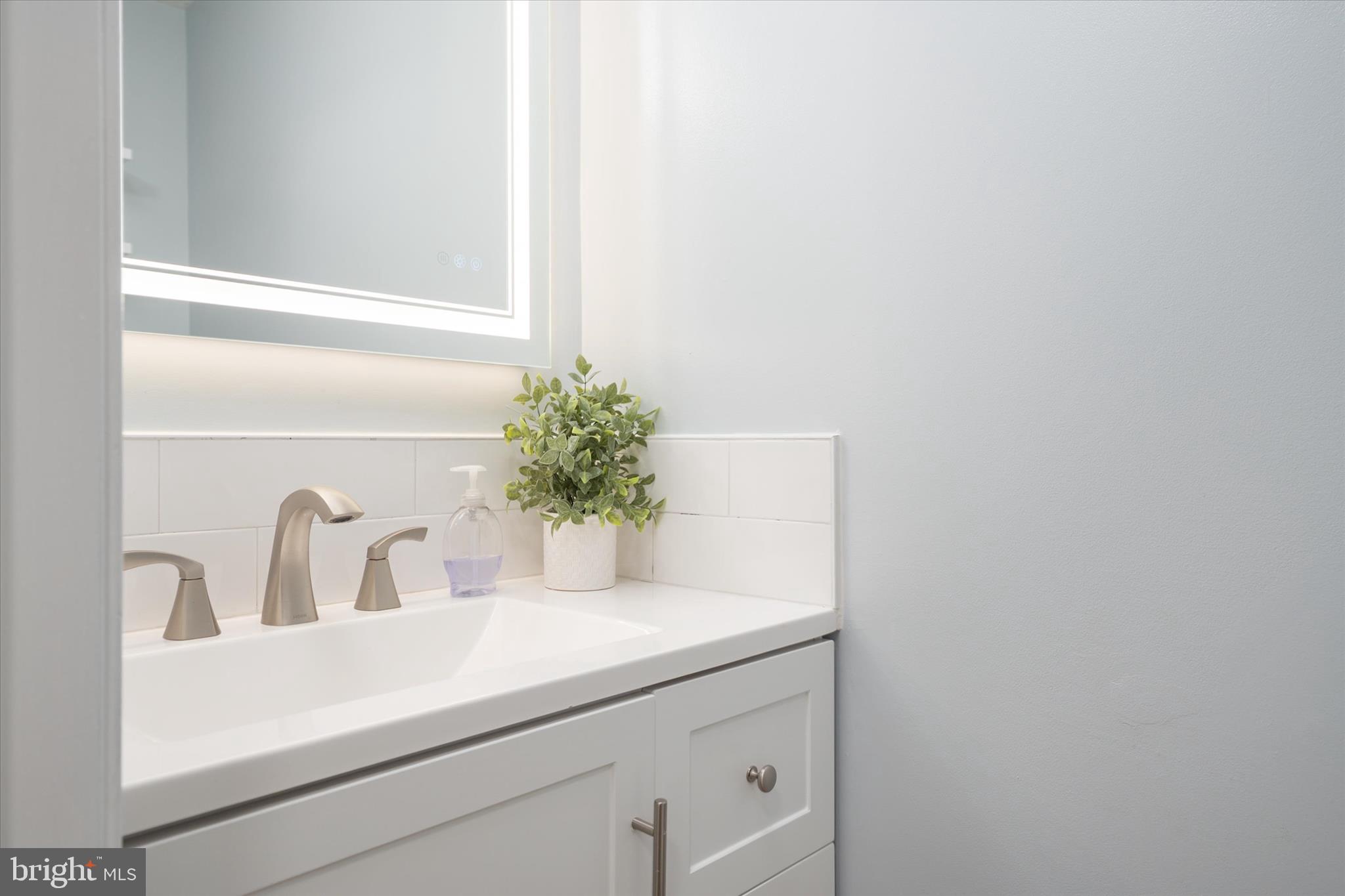 2275 Lea Court Odenton, MD 21113 - Photo 20 of 55 a bathroom with a sink and a mirror