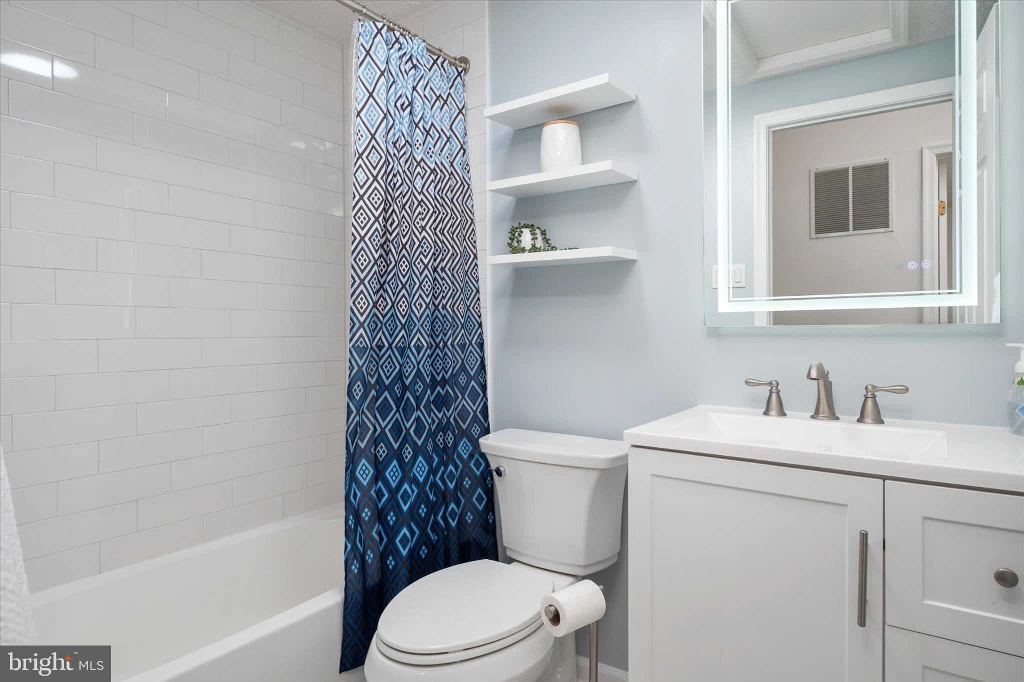 2275 Lea Court Odenton, MD 21113 - Photo 26 of 55 a bathroom with a sink a toilet and shower