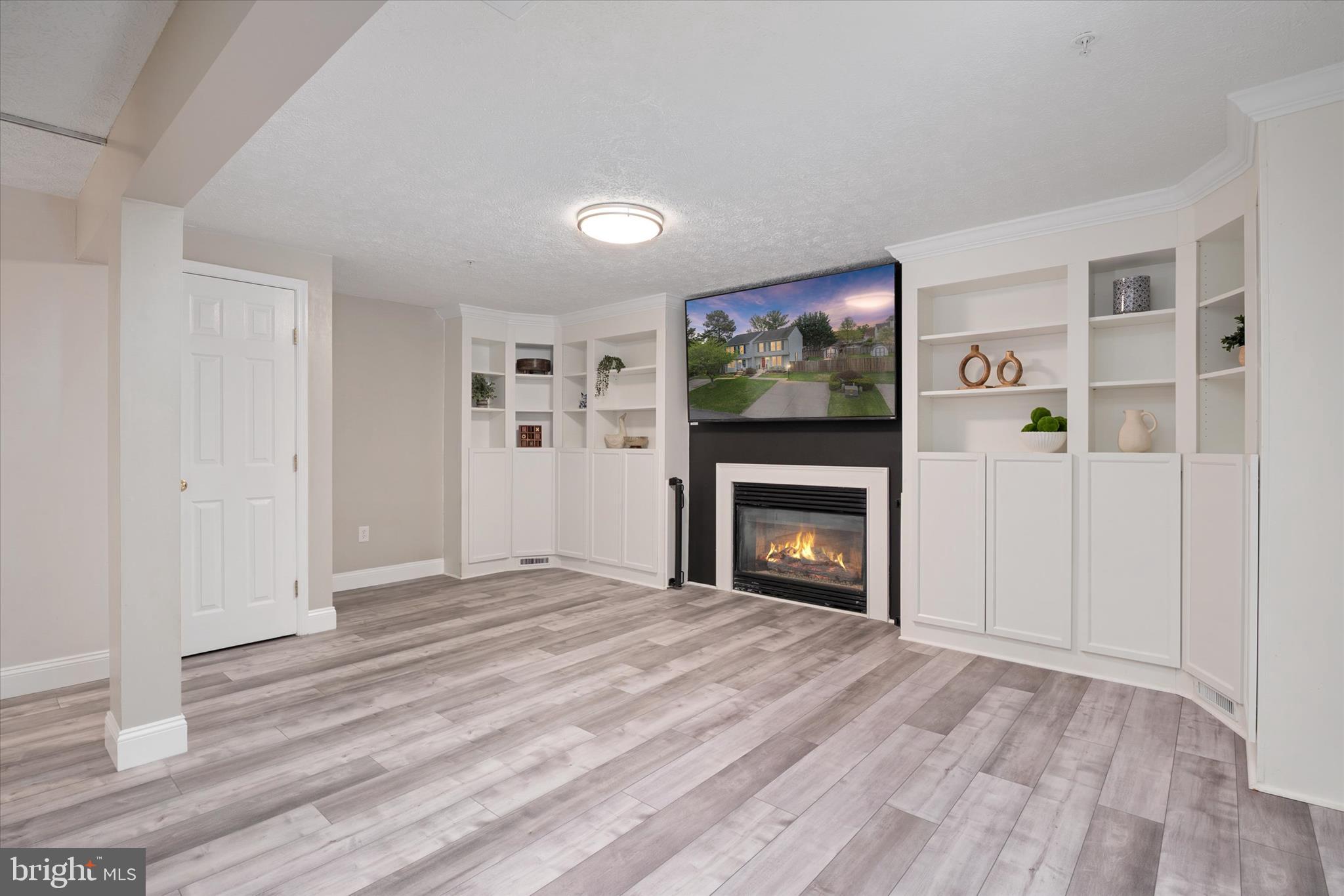 2275 Lea Court Odenton, MD 21113 - Photo 31 of 55 a view of empty room with a fireplace and fan