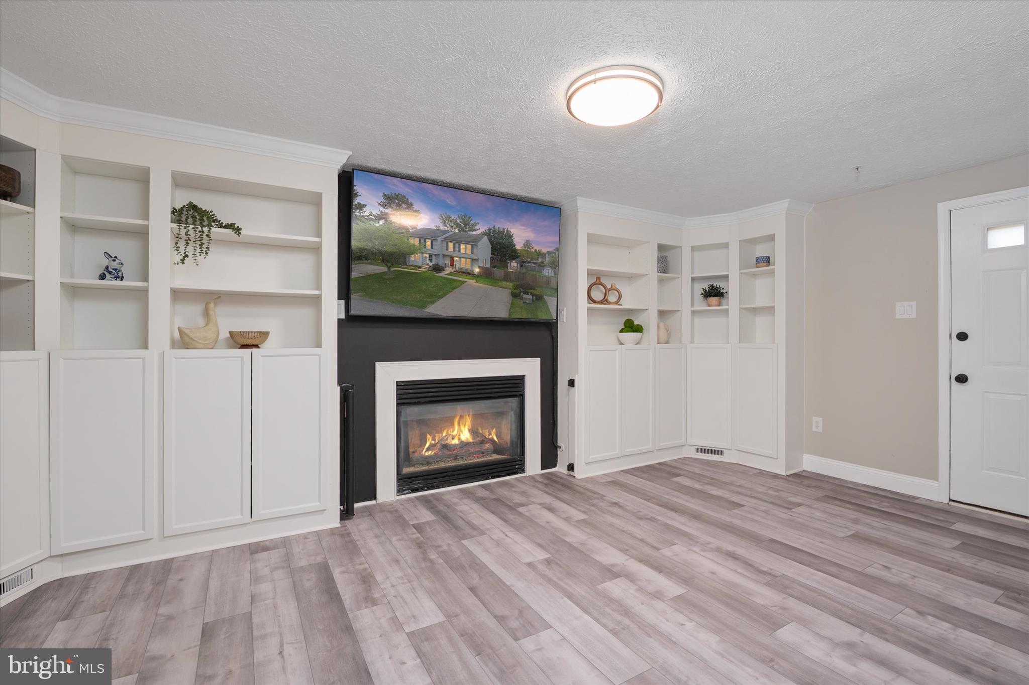 2275 Lea Court Odenton, MD 21113 - Photo 32 of 55 a view of an empty room with a fireplace and a window