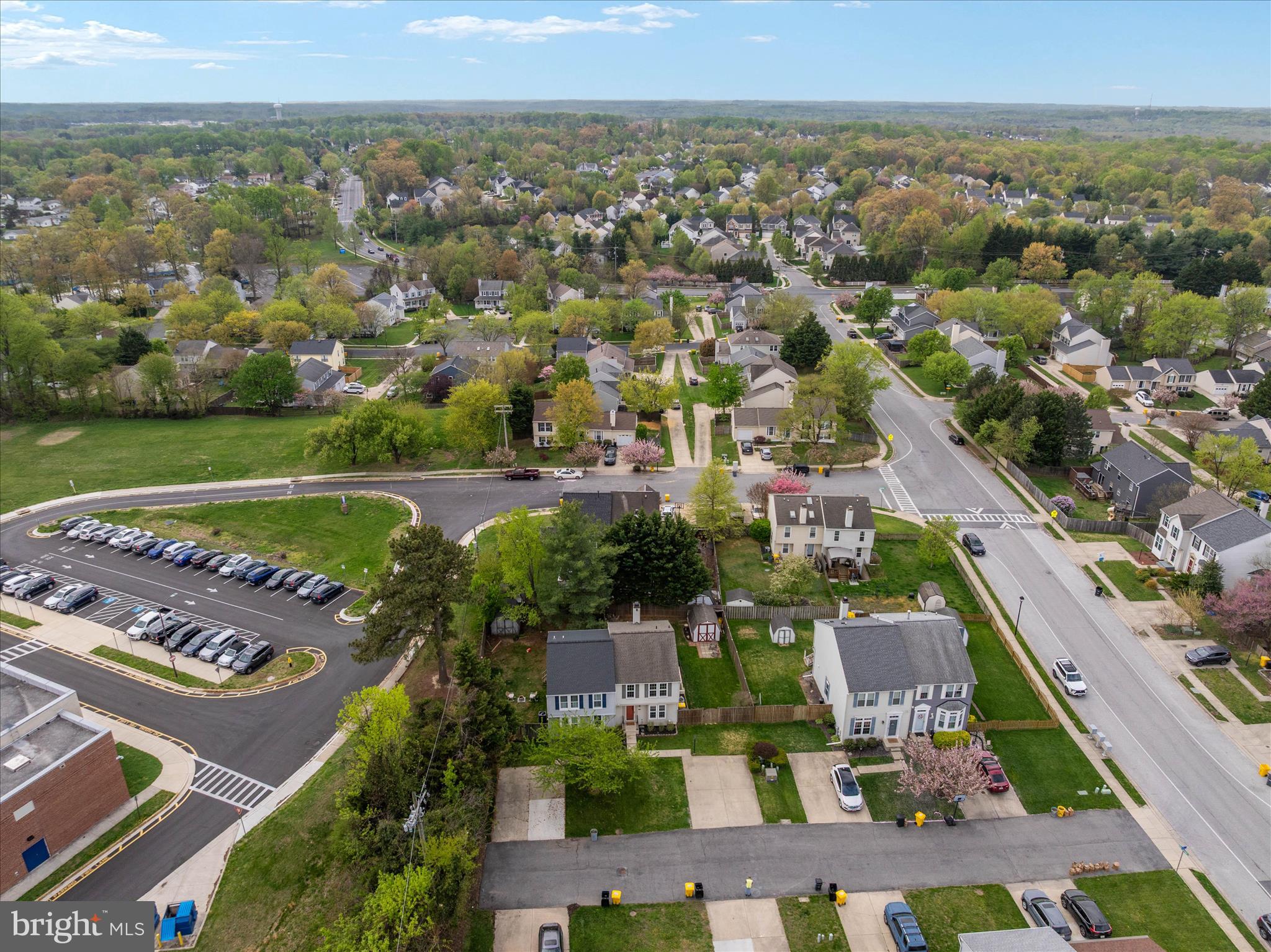 2275 Lea Court Odenton, MD 21113 - Photo 50 of 55 an aerial view of a city with lots of residential buildings and mountain view in back