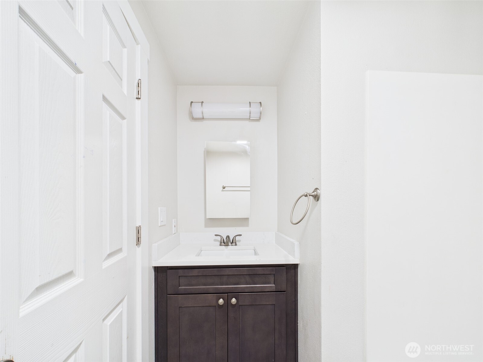 29645 18th Avenue South, Unit A301 Federal Way, WA 98003 - Photo 11 of 24 a bathroom with a sink a mirror and a shower