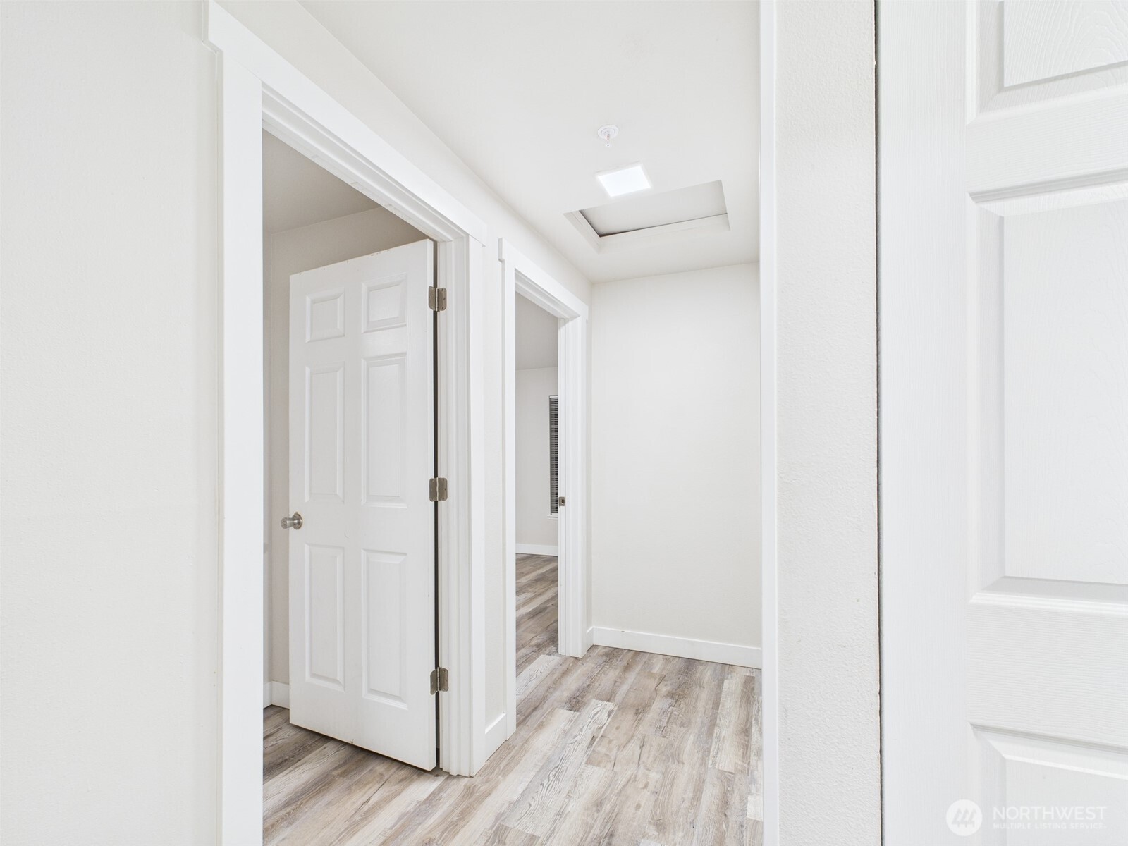 29645 18th Avenue South, Unit A301 Federal Way, WA 98003 - Photo 10 of 24 a view of a hallway with wooden floor