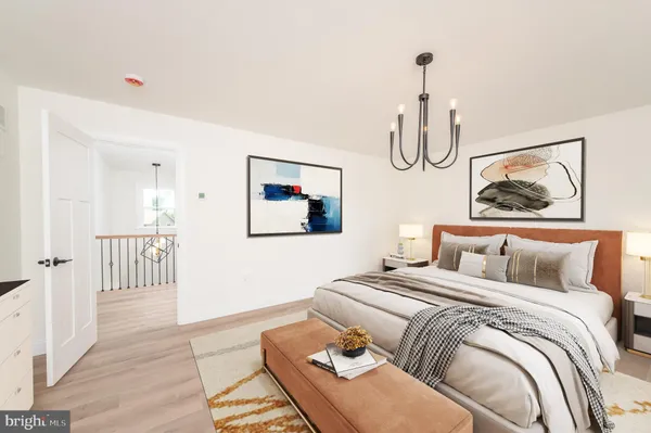 a bedroom with a bed and glass windows