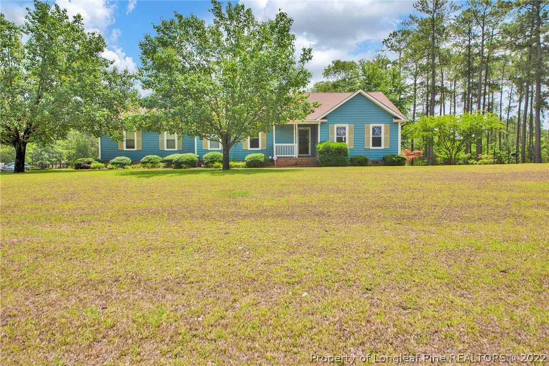 a front view of house with an outdoor space and balcony