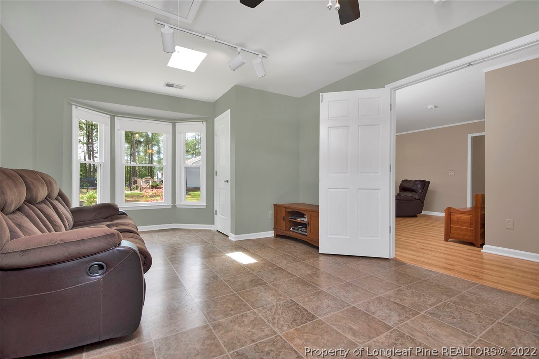 22 Woodridge Lane Cameron, NC 28326 - Photo 11 of 33 a living room with furniture and a large window