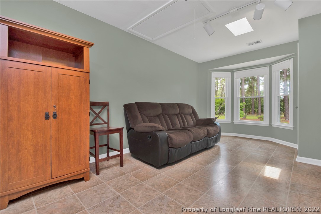 22 Woodridge Lane Cameron, NC 28326 - Photo 13 of 33 a living room with furniture and a window