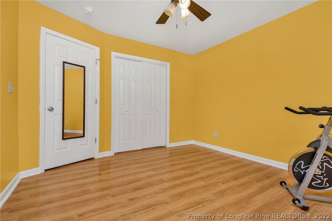 22 Woodridge Lane Cameron, NC 28326 - Photo 17 of 33 a view of a room with wooden floor and ceiling fan