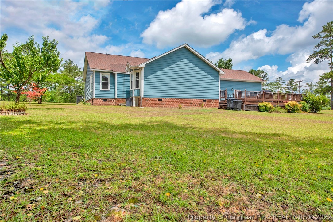 22 Woodridge Lane Cameron, NC 28326 - Photo 2 of 33 a view of a house with a yard and sitting area