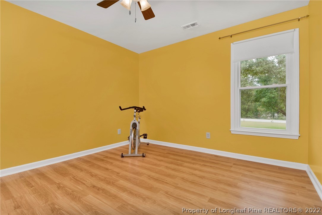 22 Woodridge Lane Cameron, NC 28326 - Photo 25 of 33 a view of a room with a wooden floor and a window