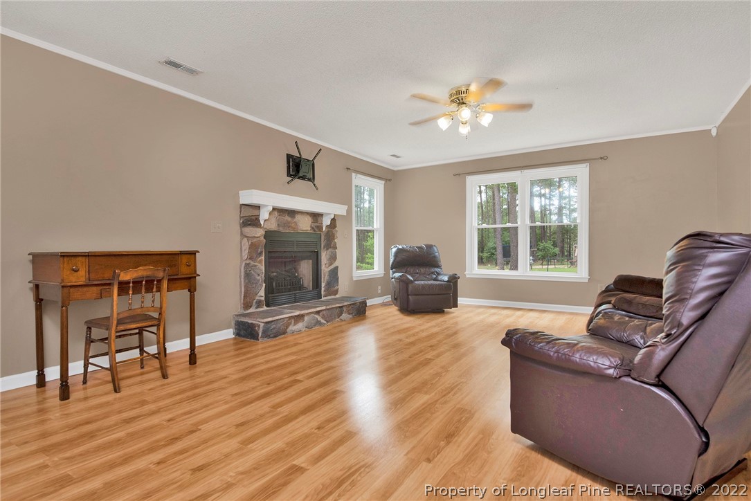 22 Woodridge Lane Cameron, NC 28326 - Photo 33 of 33 a living room with furniture and a fireplace