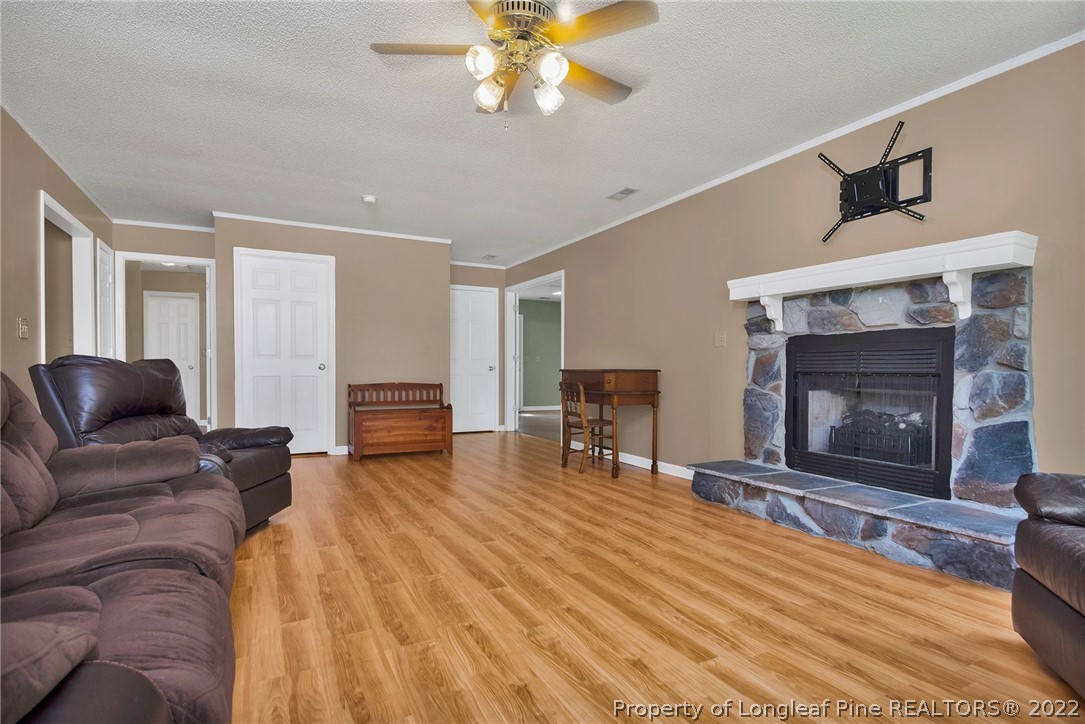 22 Woodridge Lane Cameron, NC 28326 - Photo 9 of 33 a living room with furniture and a fireplace