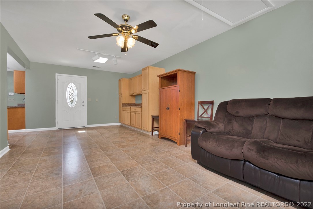 22 Woodridge Lane Cameron, NC 28326 - Photo 10 of 33 a living room with furniture and a ceiling fan