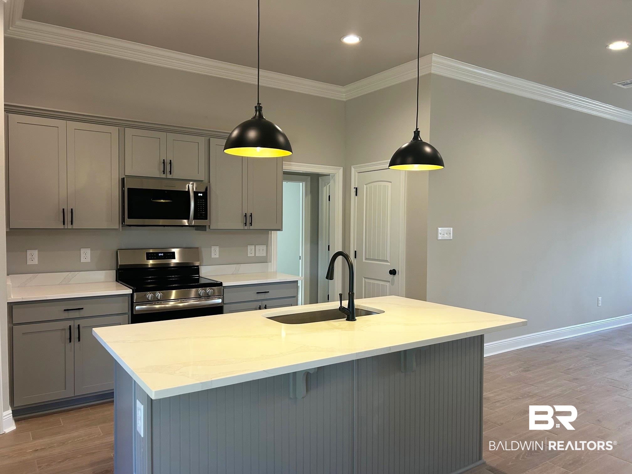 808 Sumter Loop Foley, AL 36535 - Photo 2 of 18 Kitchen with gray cabinetry, light stone counters, sink, and stainless steel appliances