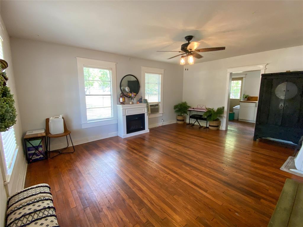 229 South Wilson Street Burleson, TX 76028 - Photo 12 of 16 a living room with furniture and a fireplace