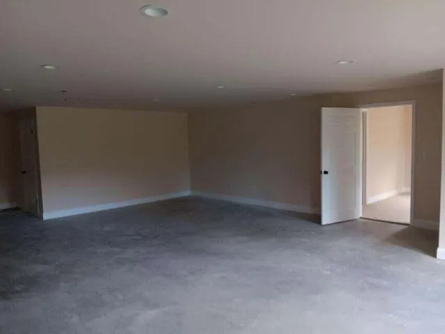 a view of a kitchen with a sink and a refrigerator