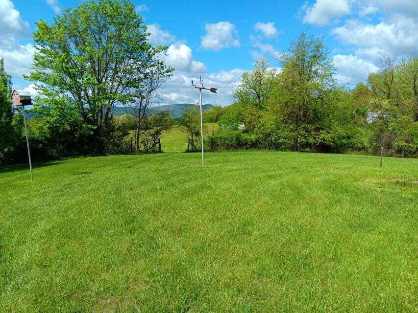 2763 Trinity Road Troutville, VA 24175 - Photo 20 of 21 a view of a grassy field with trees in the background