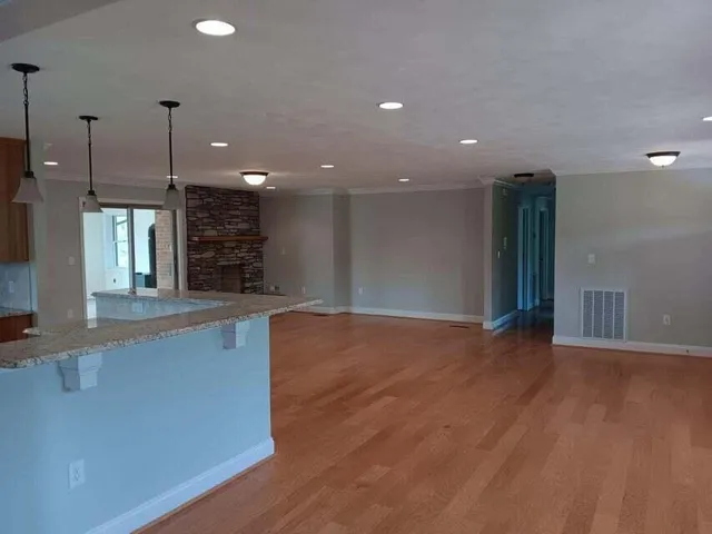 a view of a kitchen with a sink and a window