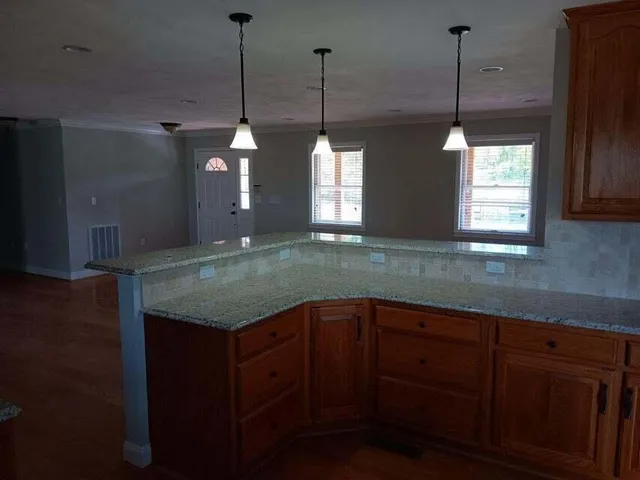 a kitchen with sink and window