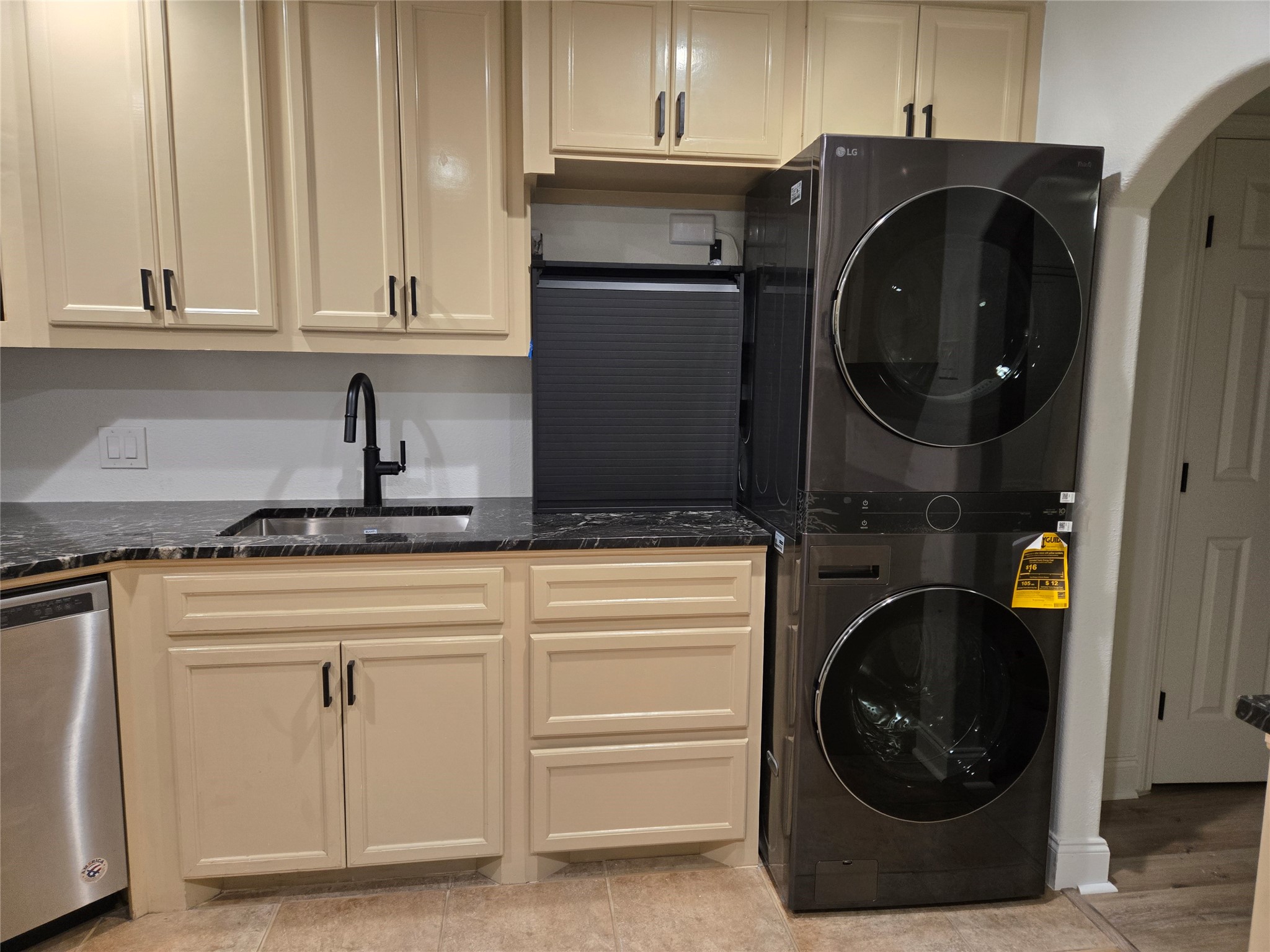 917 Adele Street Houston, TX 77009 - Photo 11 of 24 Brand-new LG ThinQ stacked washer and dryer included in unit.