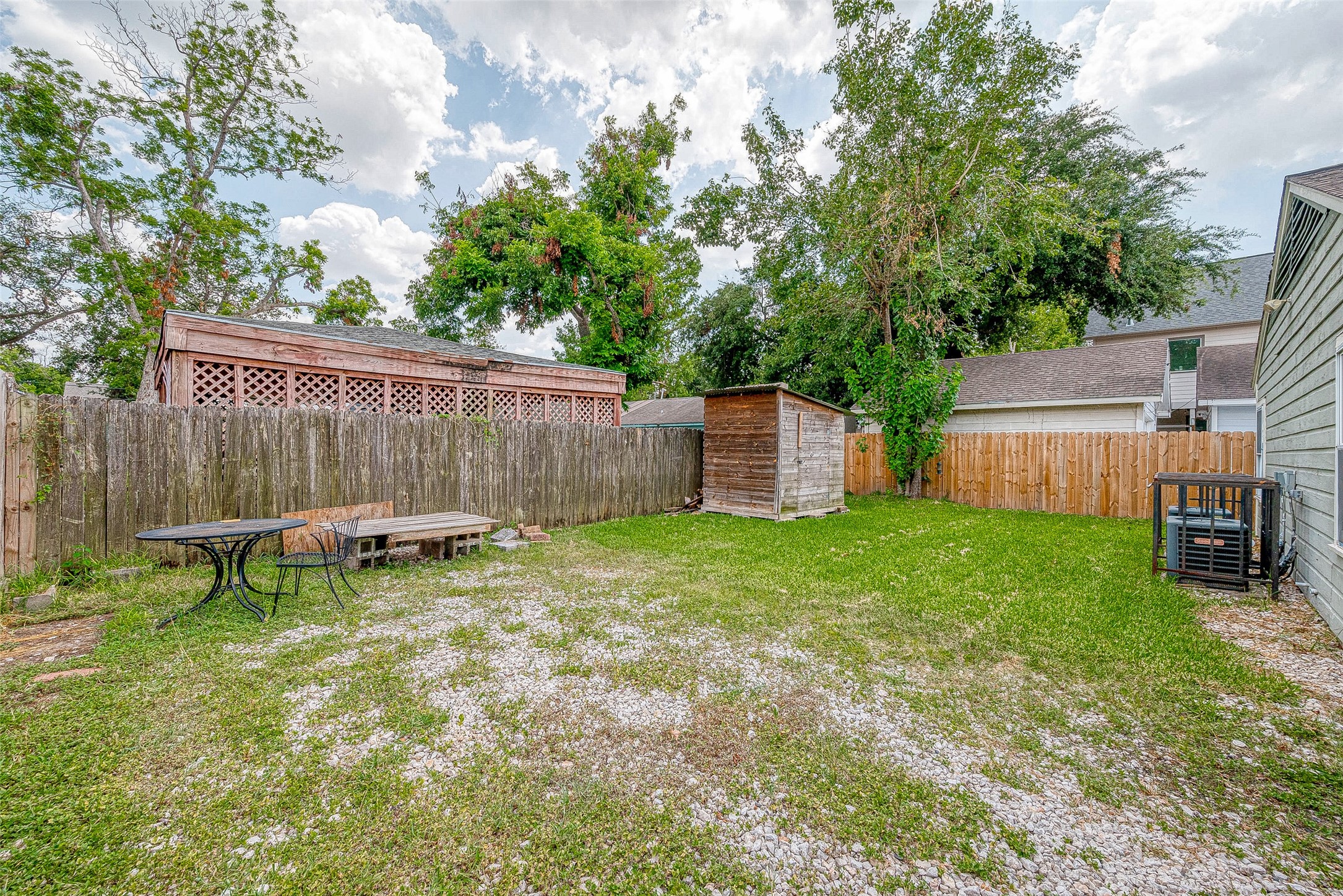 917 Adele Street Houston, TX 77009 - Photo 20 of 24 Large fully fenced backyard with green space.