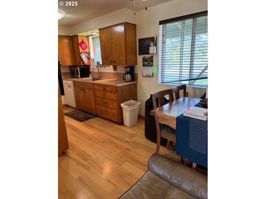 34851 Seavey Loop Road Eugene, OR 97405 - Photo 14 of 34 a living room with furniture and a flat screen tv