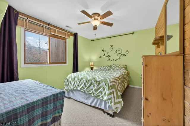 a bedroom with a bed and a table in it