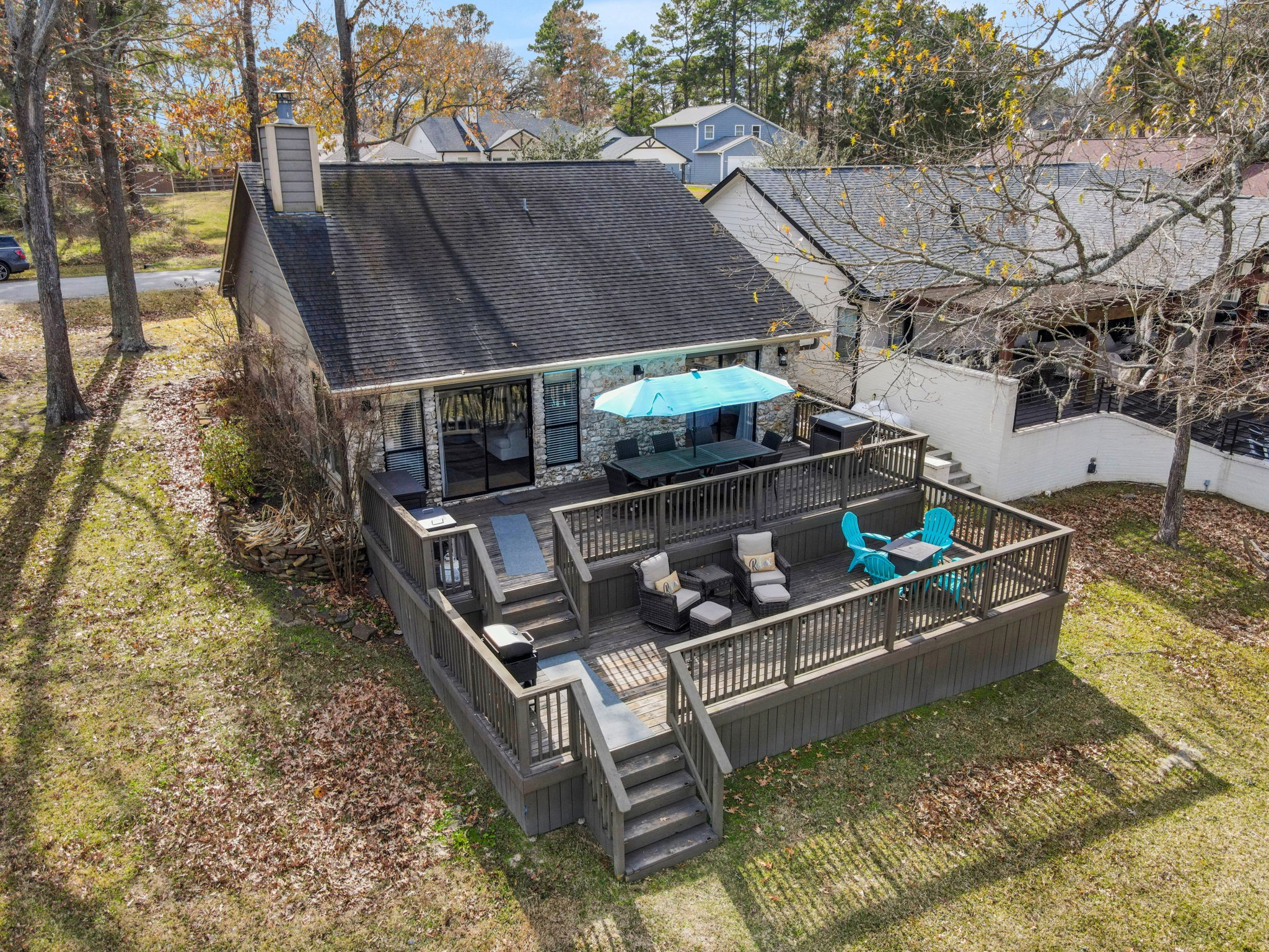 81 Harbour Point Circle Coldspring, TX 77331 - Photo 2 of 44 This lake home has great outdoor spaces including a multi level back deck