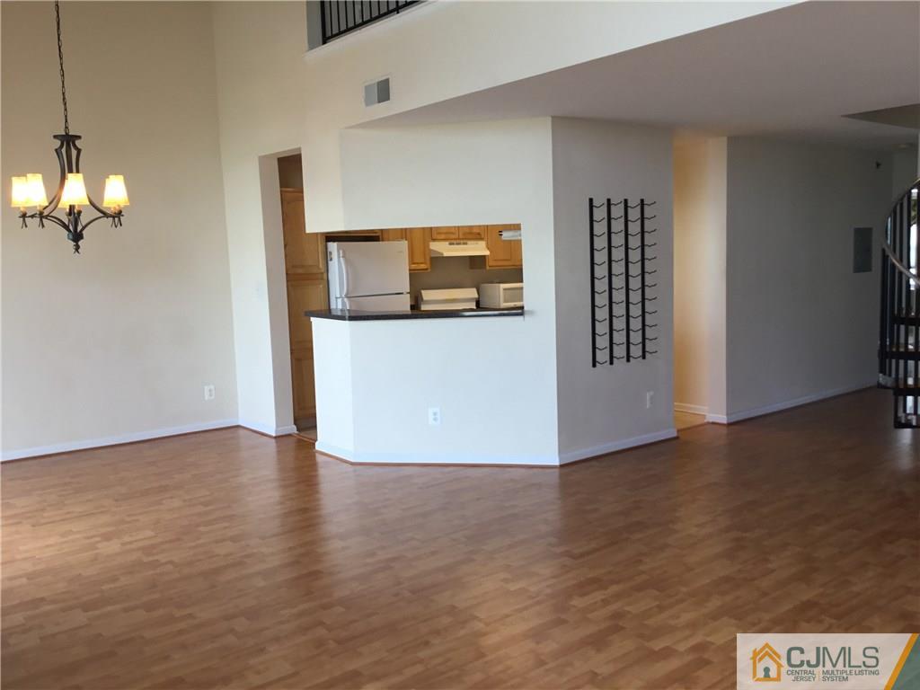 1132 Edpas Road, Unit 1132 New Brunswick, NJ 08901 - Photo 2 of 19 a view of a livingroom with wooden floor