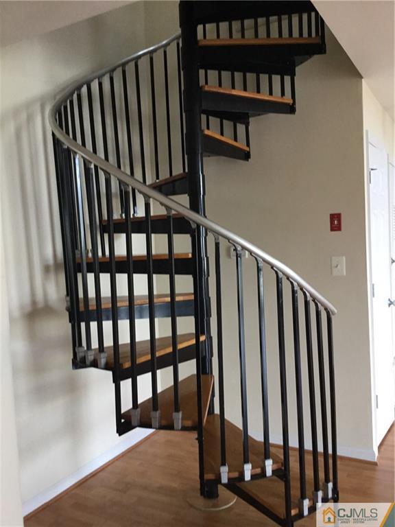 1132 Edpas Road, Unit 1132 New Brunswick, NJ 08901 - Photo 13 of 19 a view of staircase with black white walls