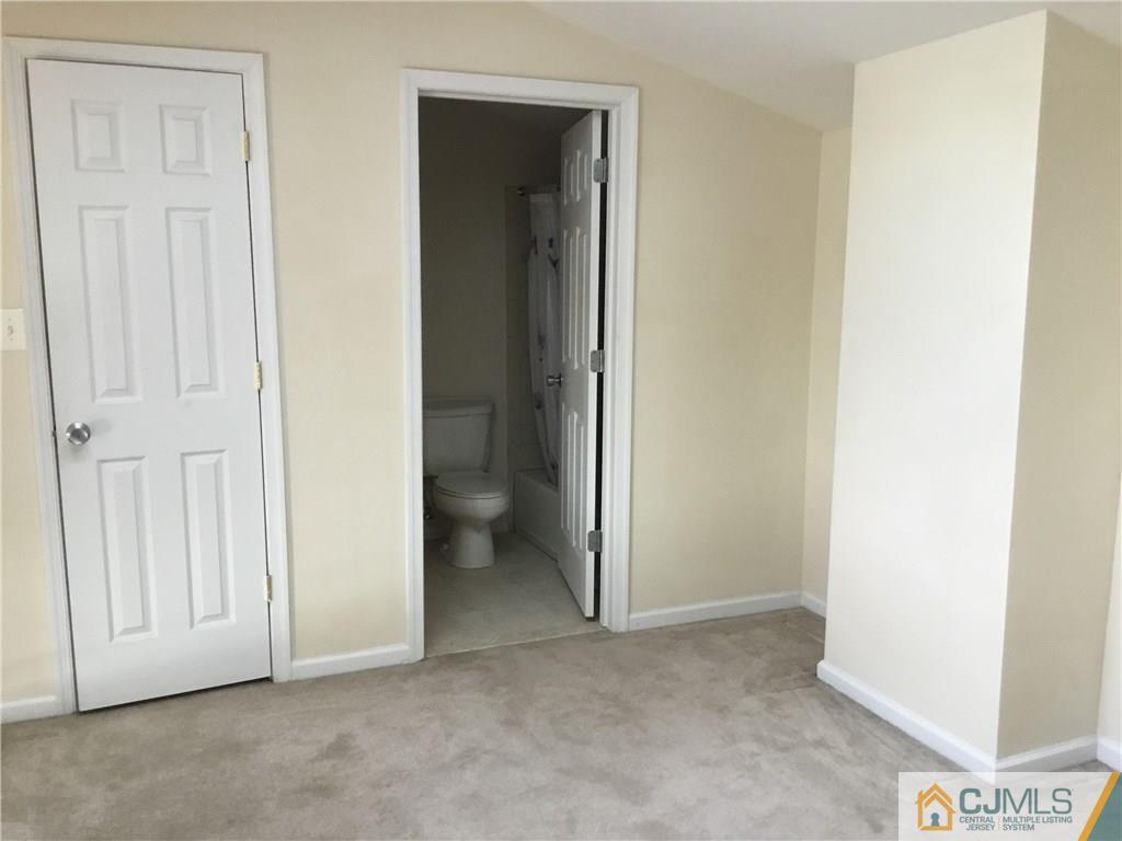 1132 Edpas Road, Unit 1132 New Brunswick, NJ 08901 - Photo 16 of 19 an empty room with windows