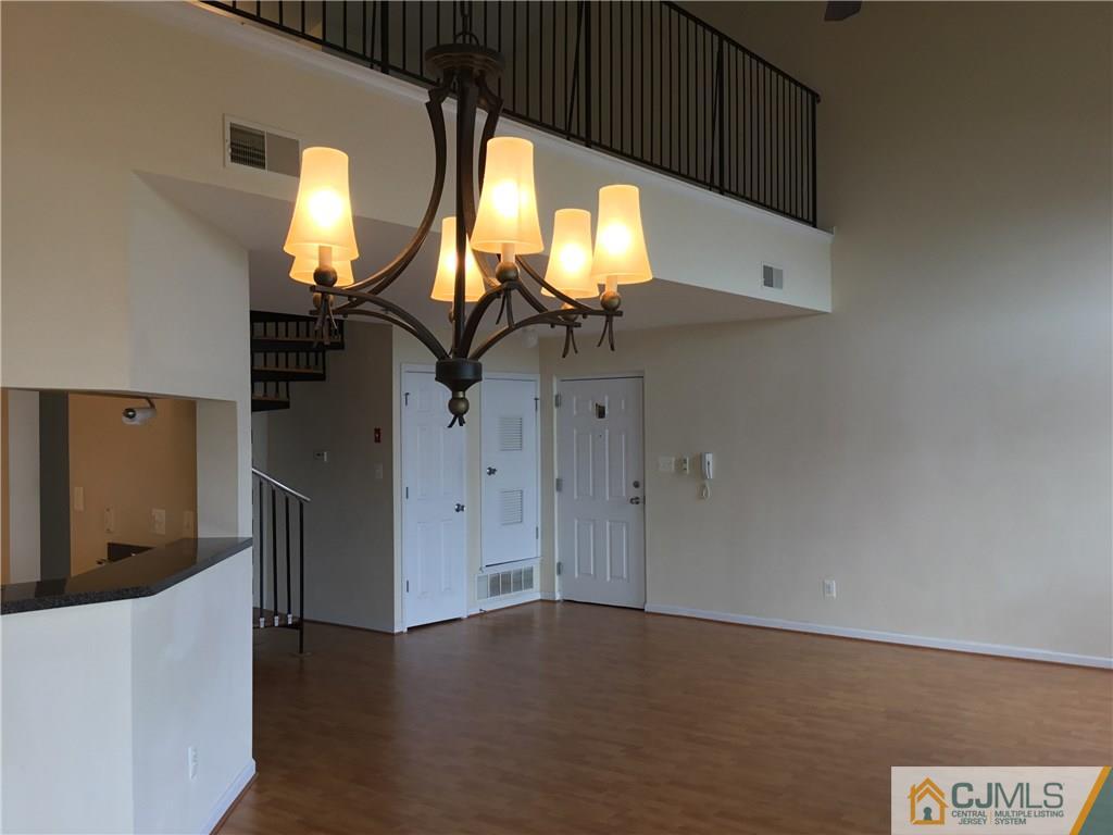 1132 Edpas Road, Unit 1132 New Brunswick, NJ 08901 - Photo 5 of 19 a view of empty room with wooden floor