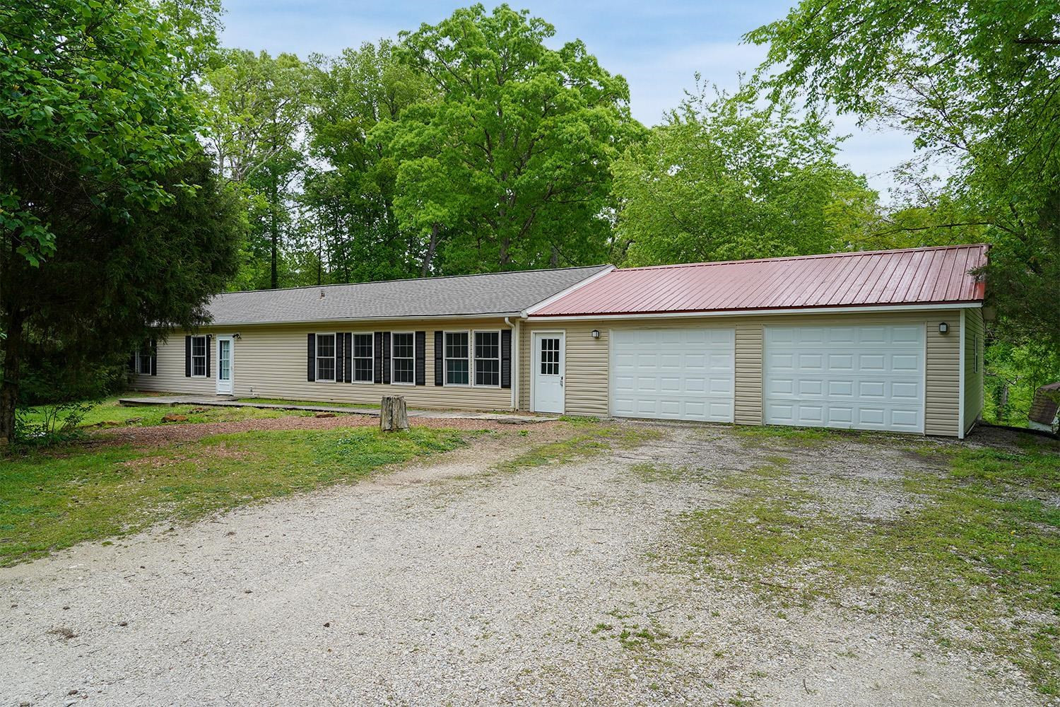 629 Brasfield Road Dresden, TN 38225 - Photo 1 of 21 a view of a yard in front of a house with garage