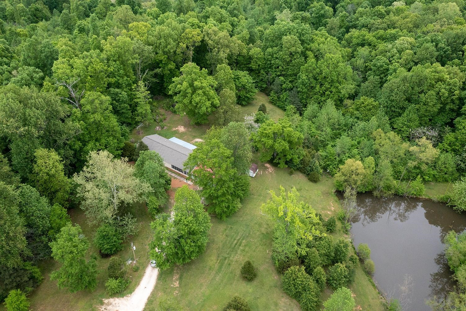 629 Brasfield Road Dresden, TN 38225 - Photo 17 of 21 an aerial view of residential house with outdoor space and trees all around