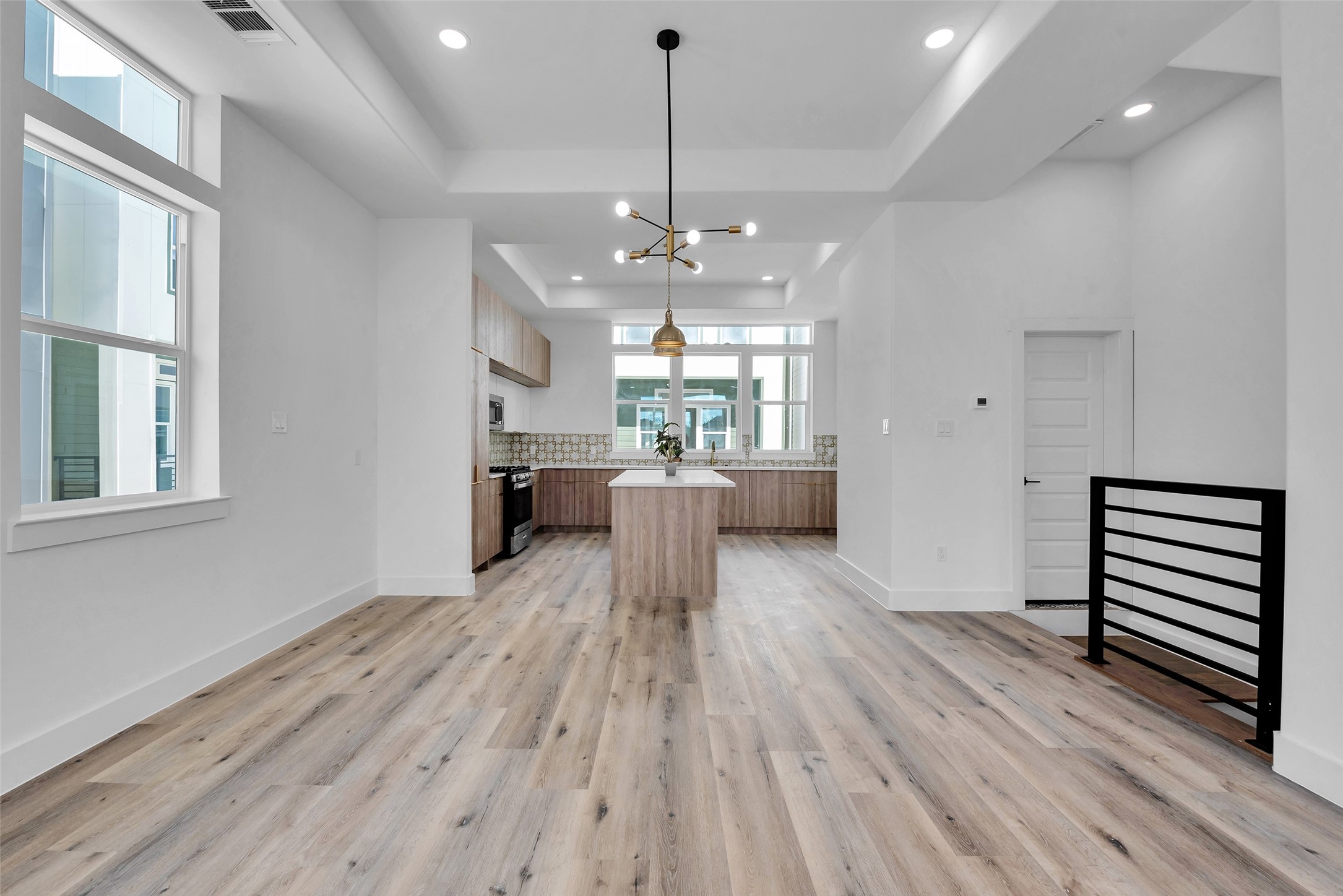 1805 Emir Street, Unit G Houston, TX 77009 - Photo 14 of 43 a view of a kitchen with a sink cabinets and wooden floor