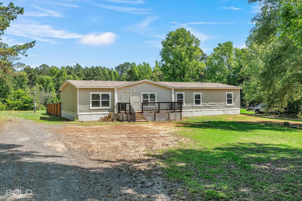 2153 Highway 2 Plain Dealing, LA 71064 - Photo 6 of 39 a front view of house with yard outdoor seating and green space
