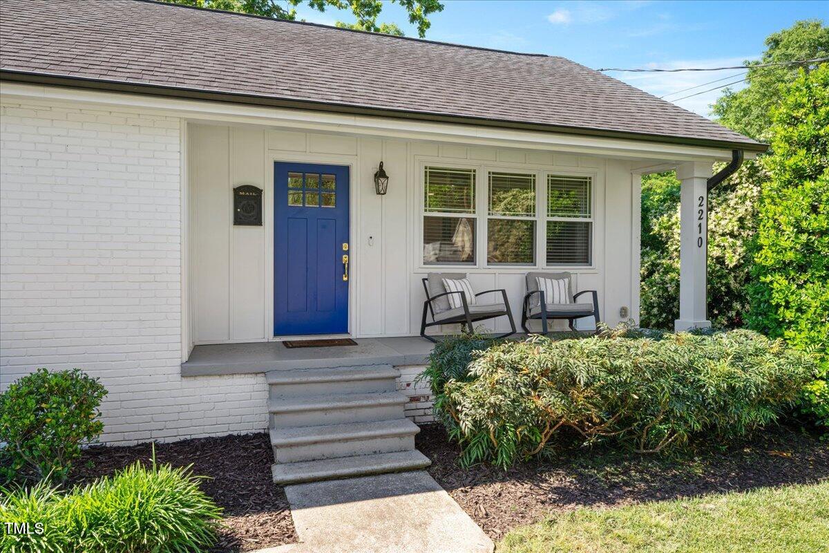 2210 Milburnie Road Raleigh, NC 27610 - Photo 4 of 30 a front view of a house with garden