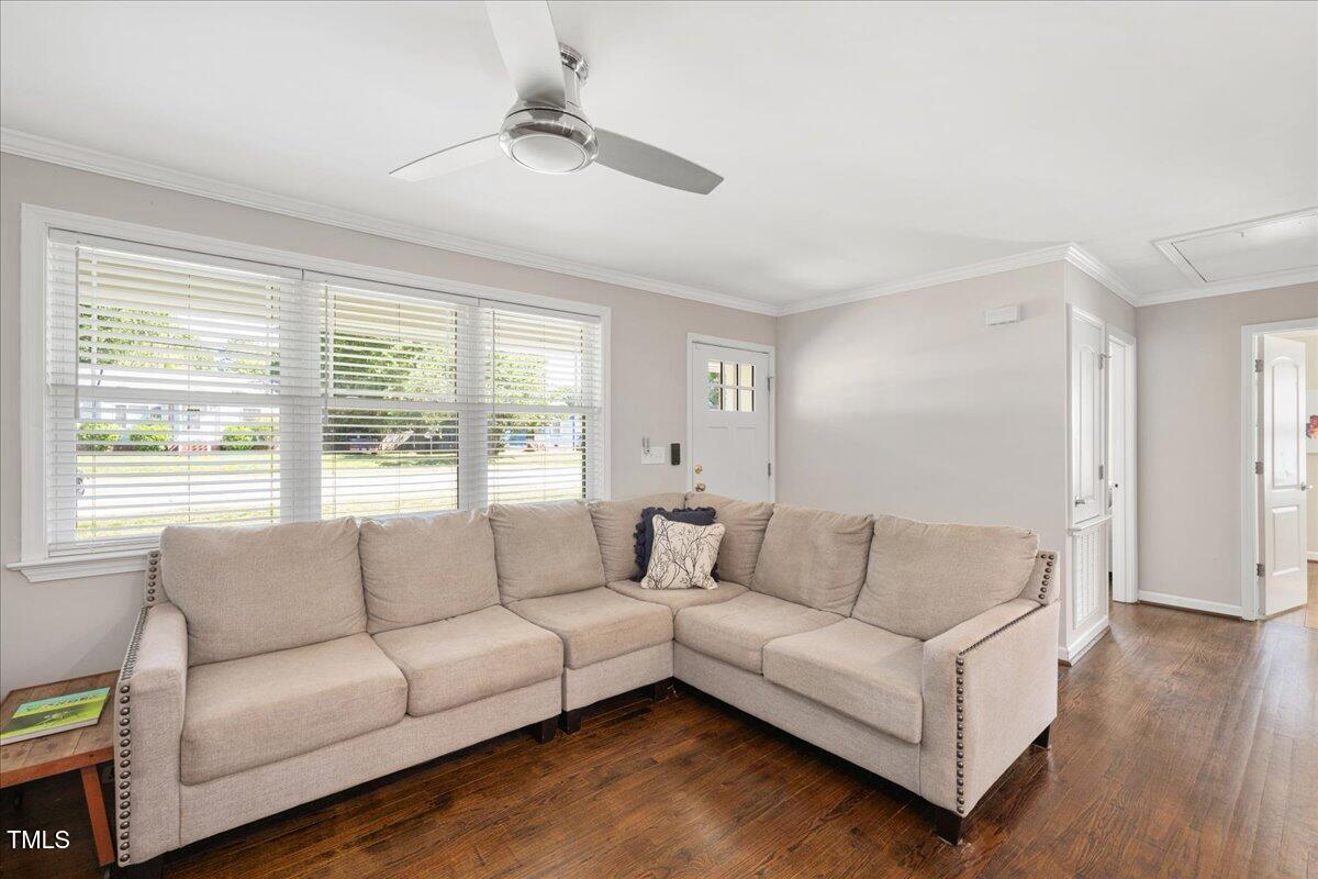 2210 Milburnie Road Raleigh, NC 27610 - Photo 8 of 30 a living room with furniture and a large window